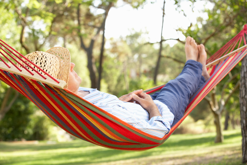 Senior Man Relaxing In Hammock